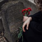 grief at gravestone