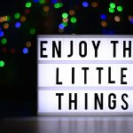 gratitude - a sign that says enjoy the little things